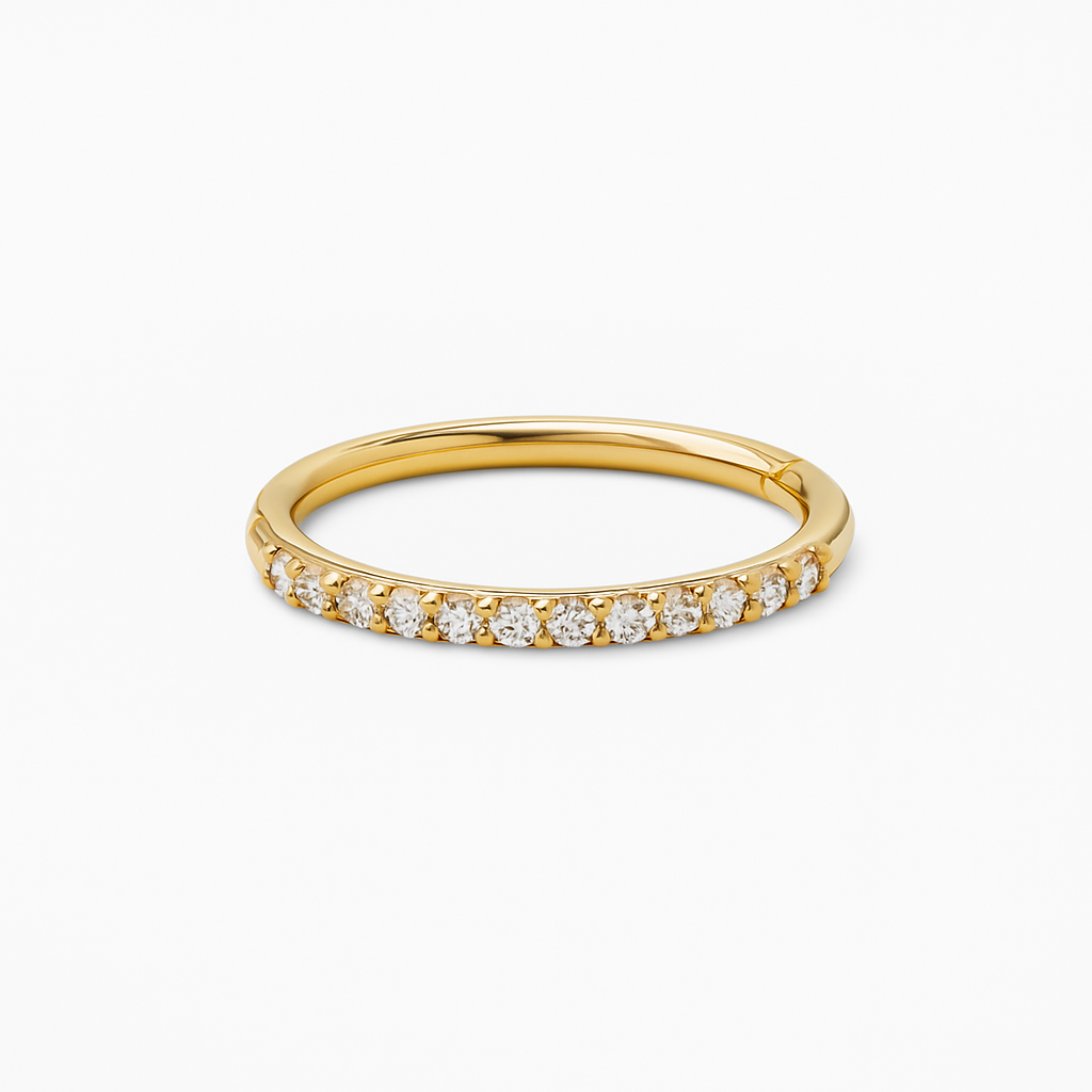 Close-up of natural diamonds side set in 14K gold helix ear clicker hoop, luxury body jewelry