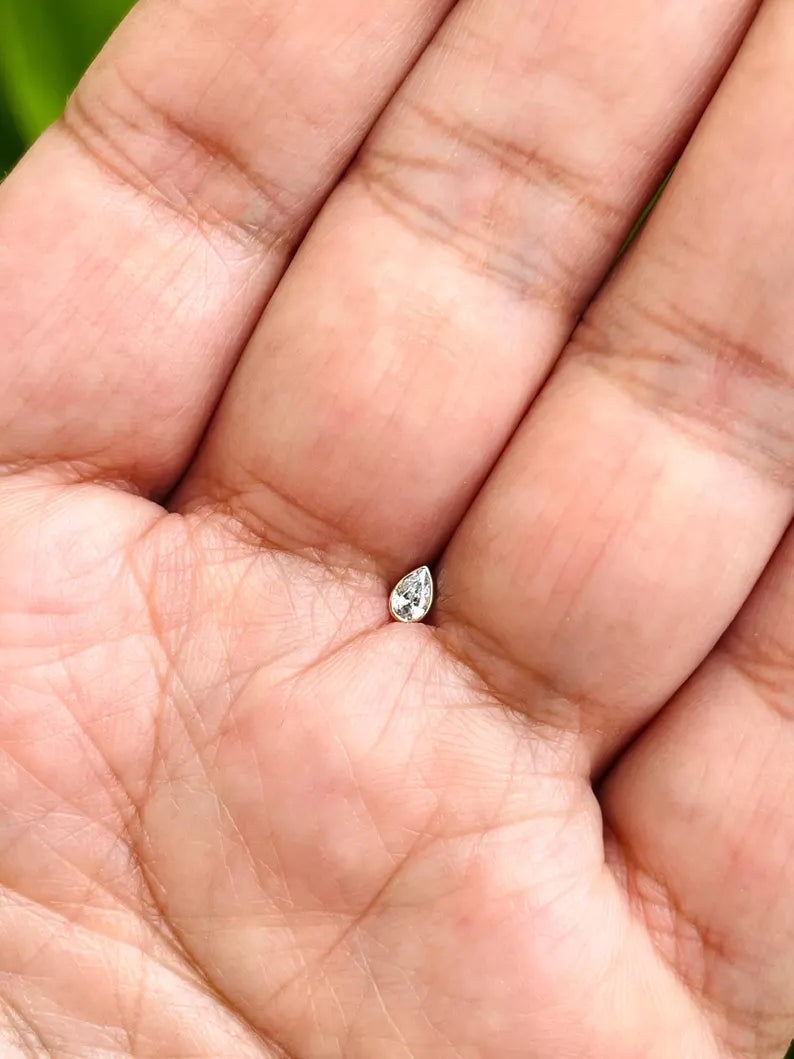 14K gold dermal top with 5mm pear shape natural diamond in bezel setting, fine piercing jewelry