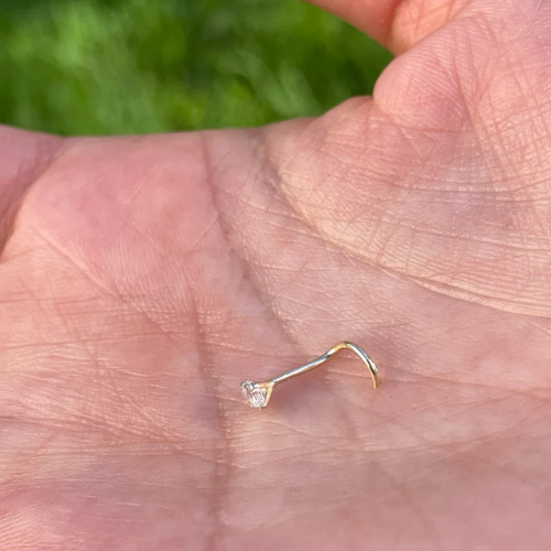 Side profile of 14K solid white gold nose ring screw featuring natural diamond